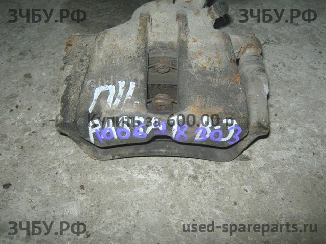 Volkswagen Passat B3 Суппорт передний левый (в сборе со скобой)